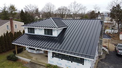 copper metal roof black house|black matte standing seam metal.